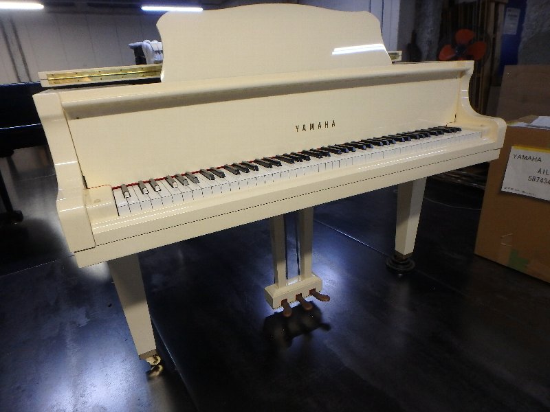 white yamaha grand piano